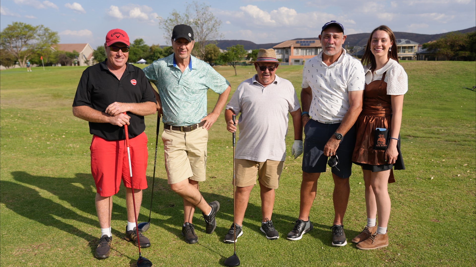 A group on the fairway in the afternoon sun